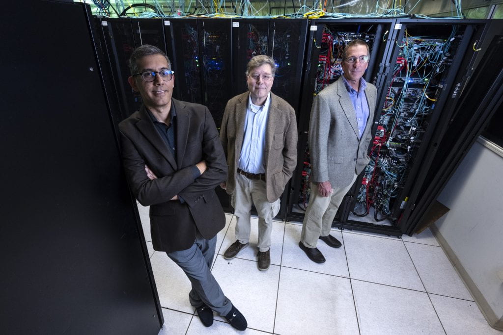 Mohammad Javad Abdolhosseini Qomi (left), UC Irvine associate professor of civil and environmental engineering and materials science and engineering, is lead principal investigator on the Geophysicist.AI project, while colleagues Eric Mjolsness (center), professor of computer science, and Russ Detwiler (right), associate professor of civil and environmental engineering, are co-principal investigators. Steve Zylius / UC Irvine