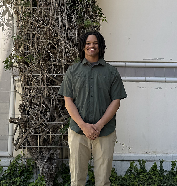 Tyler Reese Johnson, a mechanical and aerospace engineering Ph.D. student, stands in front of the Engineering Gateway building where he spends most weekdays conducting research. 
