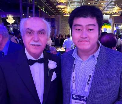 Tiantian Yang (right) with his UCI mentor Distinguished Professor Soroosh Sorooshian (left) at the American Geophysical Union 2025 Honor Ceremony, where Yang was awarded the Hydrologic Sciences Early Career Award.